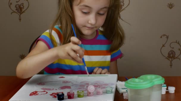 Cute Little Girl Sits Table Enjoys Drawing Paints Paper Being — Vídeo de Stock