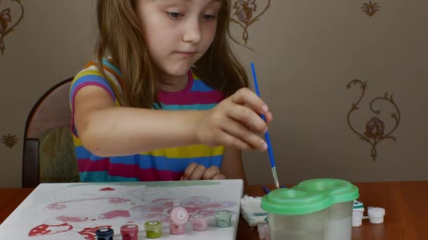 Cute Little Girl Sits Table Enjoys Drawing Paints Paper Being — Wideo stockowe