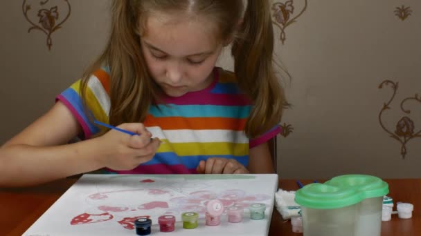 Cute Little Girl Sits Table Enjoys Drawing Paints Paper Being — Vídeo de Stock