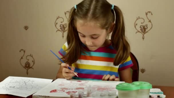 Pretty Little Artist Paints Watercolor White Paper While Sitting Table — Vídeos de Stock