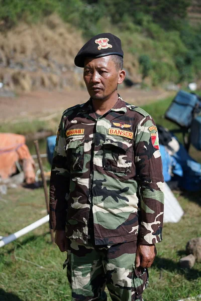 Soldiers in uniforms are performing the Indonesian Independence Day ceremony