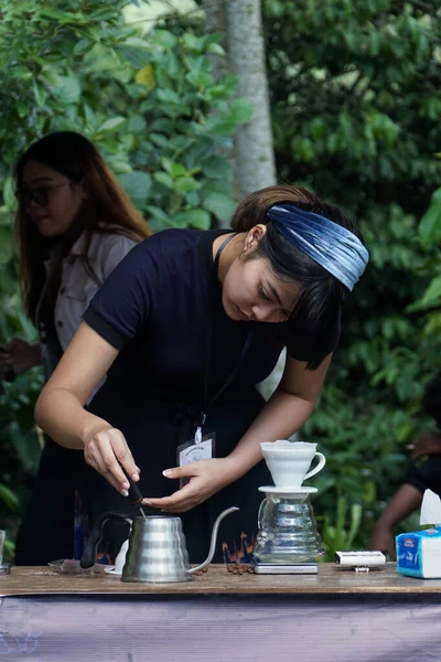 The barista is competing to make coffee