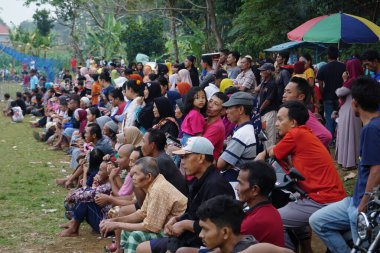 Crowds of people watching a football match