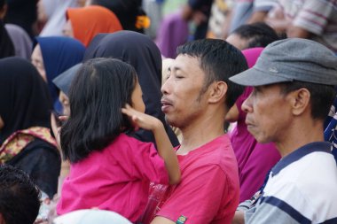 Crowds of people watching a football match