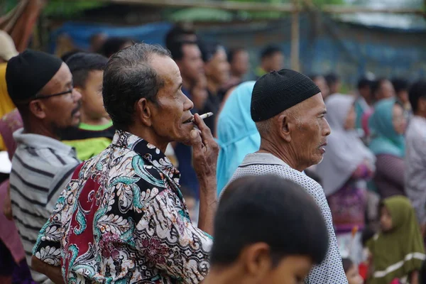 Crowds of people watching a football match