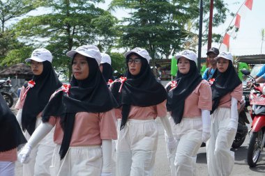 Participants of the walking competition in commemoration of the 77th Indonesian Independence Day