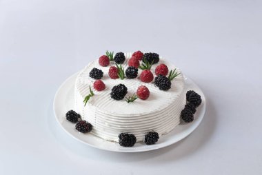 white cake with raspberry and blackberry