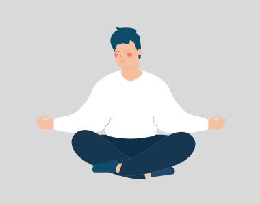 Adam yerde gözleri kapalı meditasyon yapıyor. Genç erkek bacak bacak üstüne atıp yoga yapıyor. Ergenler sabahları nefes alma egzersizleri yaparlar. İç huzur, sağlık ve olumlu vücut konsepti