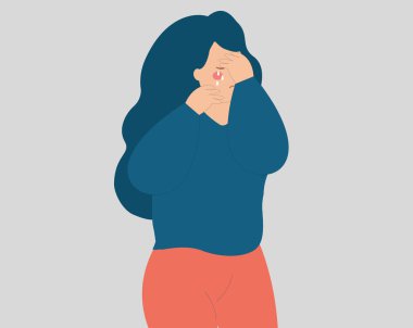 Stresli genç bir kadın ağlıyor ve yüzünü örtüyor. Üzgün genç kız negatif duygular içinde ağlıyor ve bunalıma giriyor. Akıl sağlığı bozukluğu kavramı. Kadın istismarı ve zorbalığının resmi.