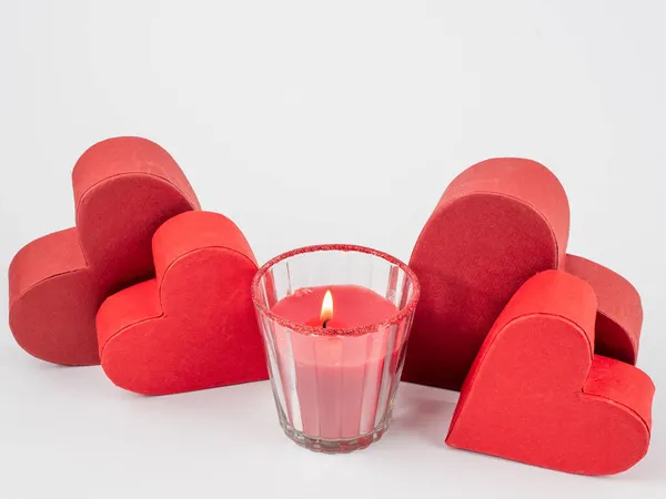 Red heart and candle on a white background. Royalty Free Stock Photos