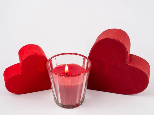 Red heart and candle on a white background. Stock Image