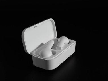 Siyah arka planda beyaz kablosuz kulaklık.