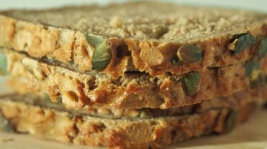 bread with pumpkin seeds on a white background. Pumpkin bread.