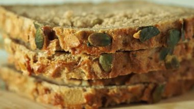 bread with pumpkin seeds on a white background. Pumpkin bread.