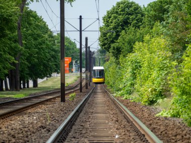 Berlin, Germany, May 17, 2022. Yellow Tram on the railway tracks. Berlin, Germany.