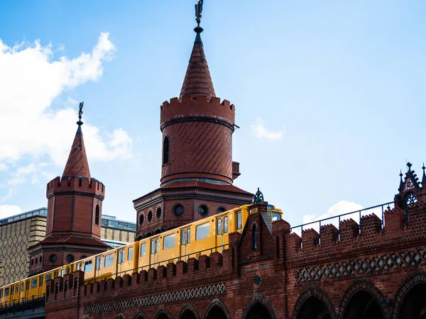 Yellow train in Berlin. Train at the station. Yellow train on the Oberbaum bridge in Berlin, Germany