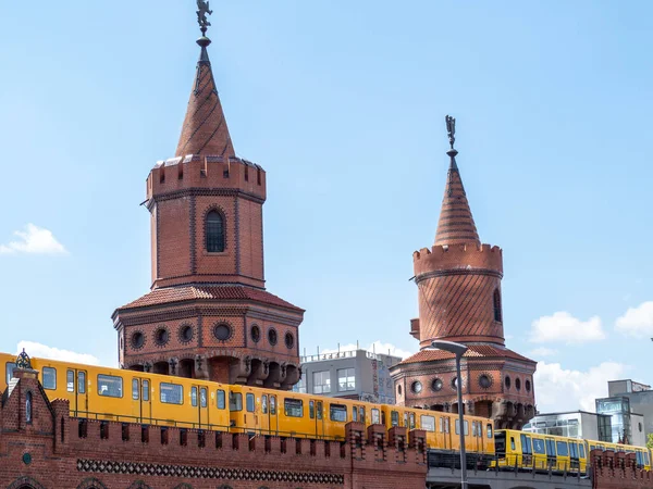 Yellow train in Berlin. Train at the station. Yellow train on the Oberbaum bridge in Berlin, Germany