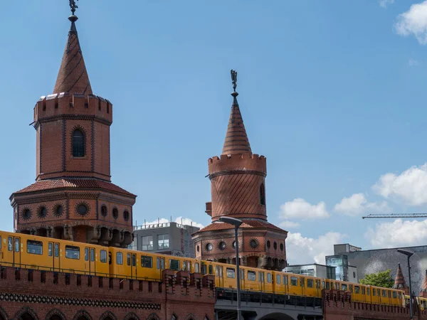 Yellow train in Berlin. Train at the station. Yellow train on the Oberbaum bridge in Berlin, Germany