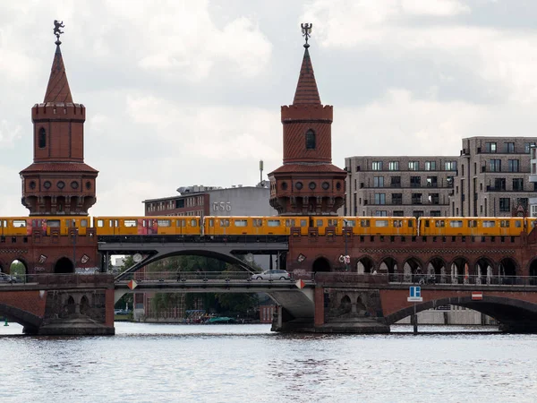 Yellow train in Berlin. Train at the station. Yellow train on the Oberbaum bridge in Berlin, Germany