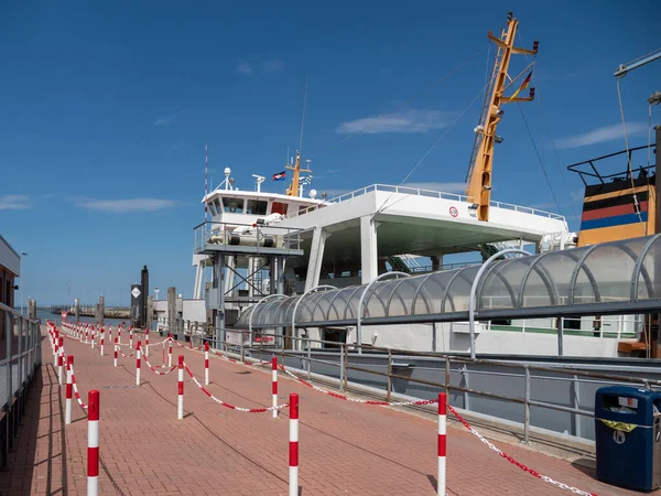 The barge transports cars and people. Barge for transportation.