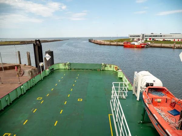 The barge transports cars and people. Barge for transportation.