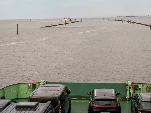 The barge transports cars and people. Barge for transportation.