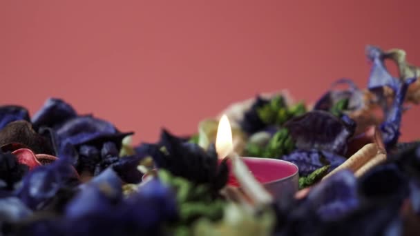 Rotating Burning Candle Flower Potpourri Candle Close High Quality Footage — 图库视频影像