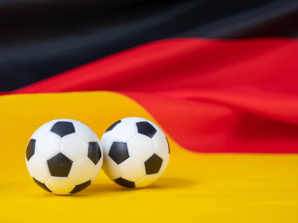 Soccer ball on the German flag. The ball against the background of the German flag. German football league concept.