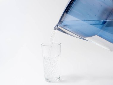 Jug with water filter made of transparent plastic. Drinking water filter.