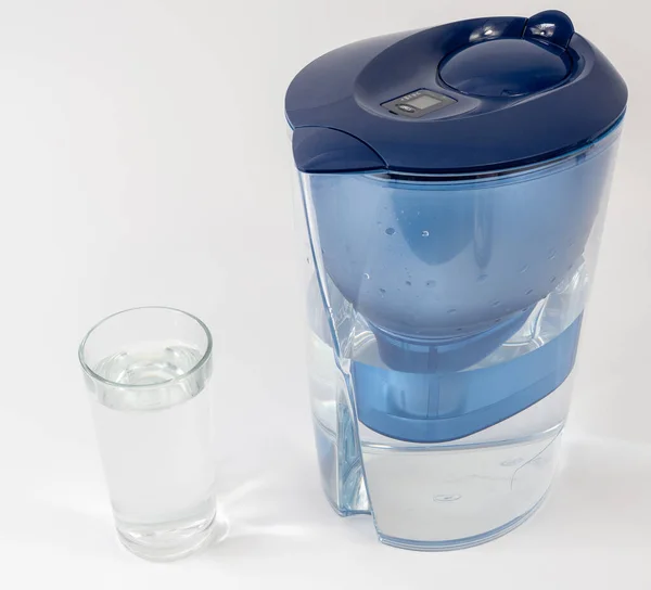 Jug with water filter made of transparent plastic. Drinking water filter.
