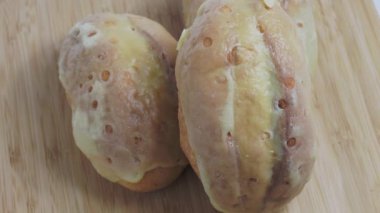 Bun with cheese. Rotating cheese buns. Freshly baked cheese buns.