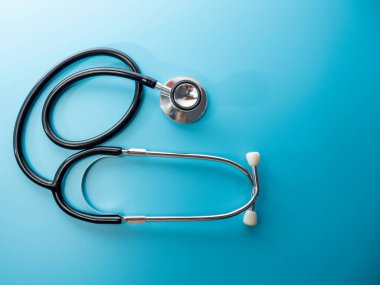 Medical stethoscope. Stethoscope on a blue background close up.
