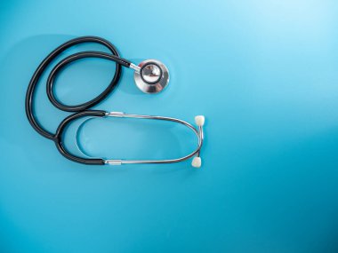 Medical stethoscope. Stethoscope on a blue background close up.