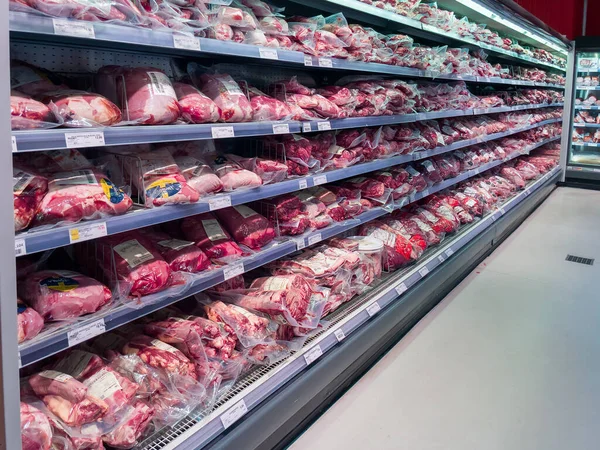 Berlin, Germany. August 06, 2022. Fresh meat products in a butcher shop. The store has a refrigerator with meat products.
