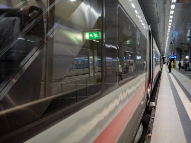 Fast train on the platform. Germany Berlin Hauptbahnhof. Passenger train.