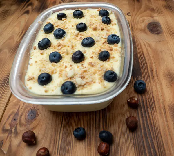 Homemade blueberry cake on a wooden table. Dessert, snack or breakfast. Close-up.