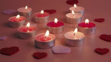 Candles on a pink background. Love concept. High quality 4k footage