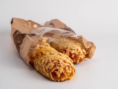 Baked goods cheese bun on a white background. Cheese bun close-up.