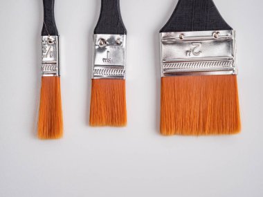 Brush for painting on a white background. Three molar brushes.