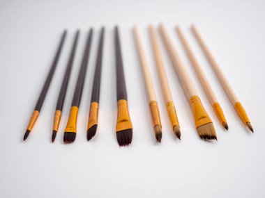 Various artist's brushes on a white background. Paint brushes.