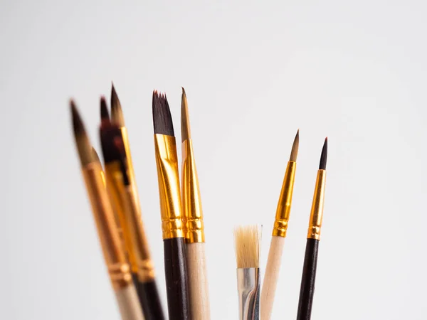 Various artist\'s brushes on a white background. Paint brushes.