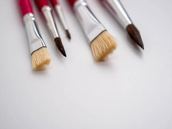 Various artist\'s brushes on a white background. Paint brushes.