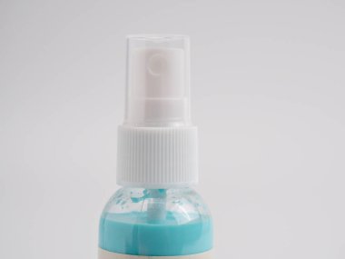 Vials of acrylic spray paint on a white background.