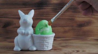 Painted Easter eggs. Easter. Painted Easter eggs on a wooden background. High quality 4k footage