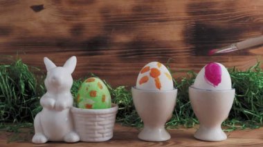 Painted Easter eggs. Easter. Painted Easter eggs on a wooden background. High quality 4k footage