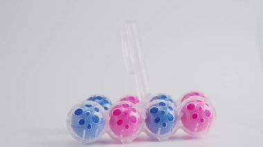 Toilet balls on a white background. Cleaning agent. High quality 4k footage