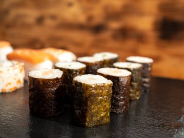 Japanese kitchen. Sushi on a dark background. Sushi close up.
