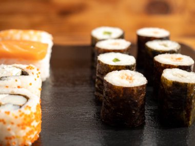 Japanese kitchen. Sushi on a dark background. Sushi close up.