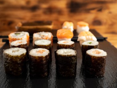 Japanese kitchen. Sushi on a dark background. Sushi close up.