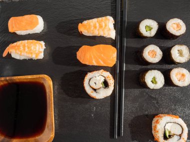 Japanese kitchen. Sushi on a dark background. Sushi close up.